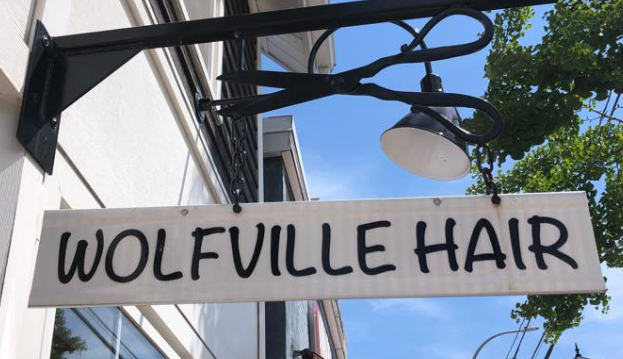 A photo of the Wolfville Hair sign.