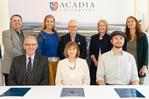 representatives from Acadia, the ASU and the Town gather to extend the MOU