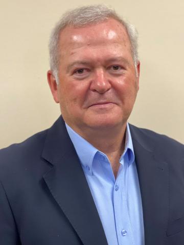 Headshot of interim CAO, Rob Simonds. He is wearing a navy jacket and has short hair.