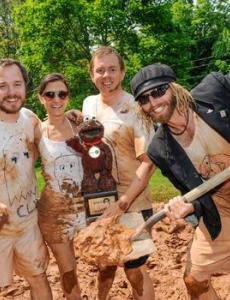 people playing in mud