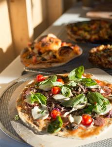 A photo of pizzas made in the community pizza oven. 
