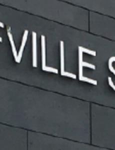 Photo of the Wolfville School Sign on the school.