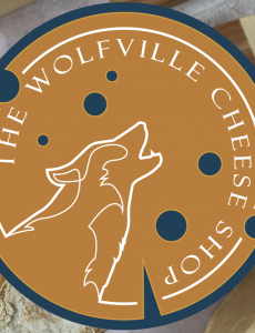 The Wolfville Cheese Shop logo, featuring a cheese wheel and a wolf. 
