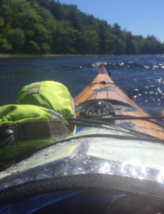 A picture of an orange kayak