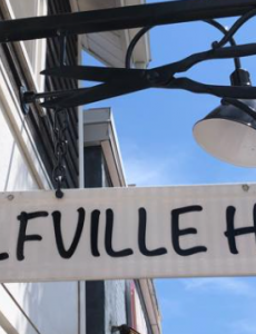 A photo of the Wolfville Hair sign.